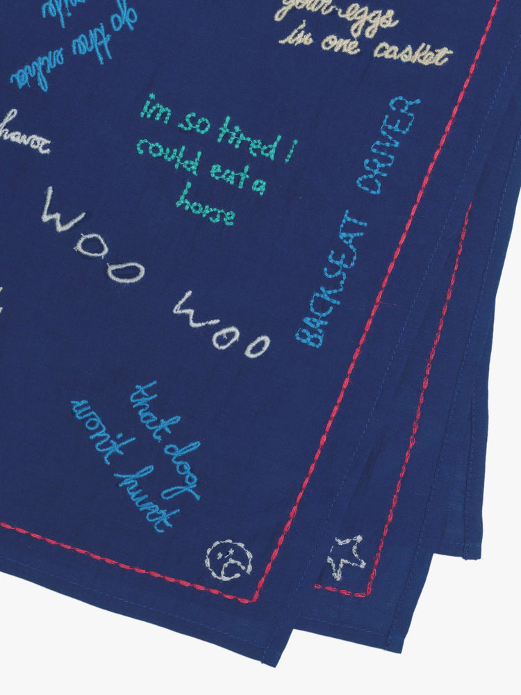 Close up square scarf designed to be worn around the neck, on your head or tied on a bag.