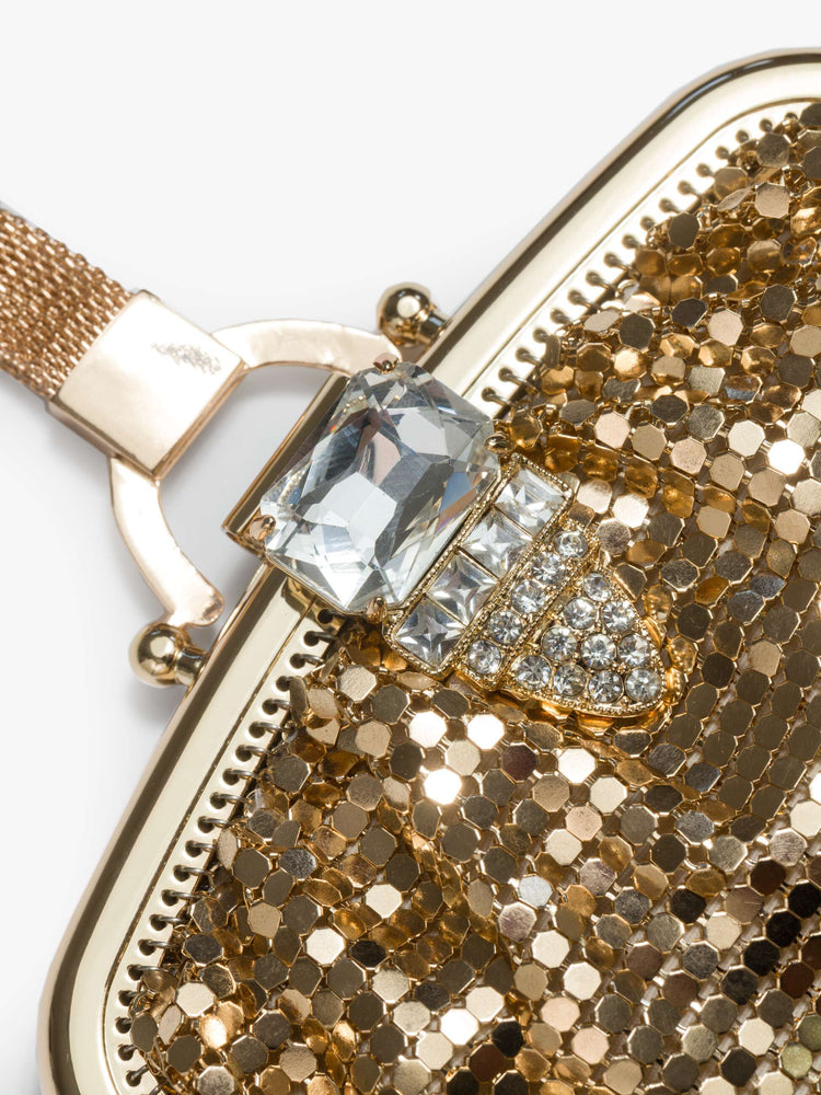 Clasp view of a  vintage-inspired wristlet with a clasp closure and short strap.