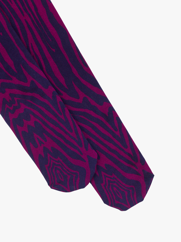 Flat view of a woman high-waisted tights with a closed toe in a trippy pink and blue zebra print with an opaque finish.