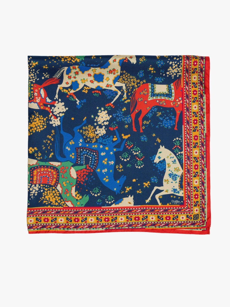 Flat folded view square scarf made from 100% silk in navy blue with a folk art-inspired horse print and orange trim.