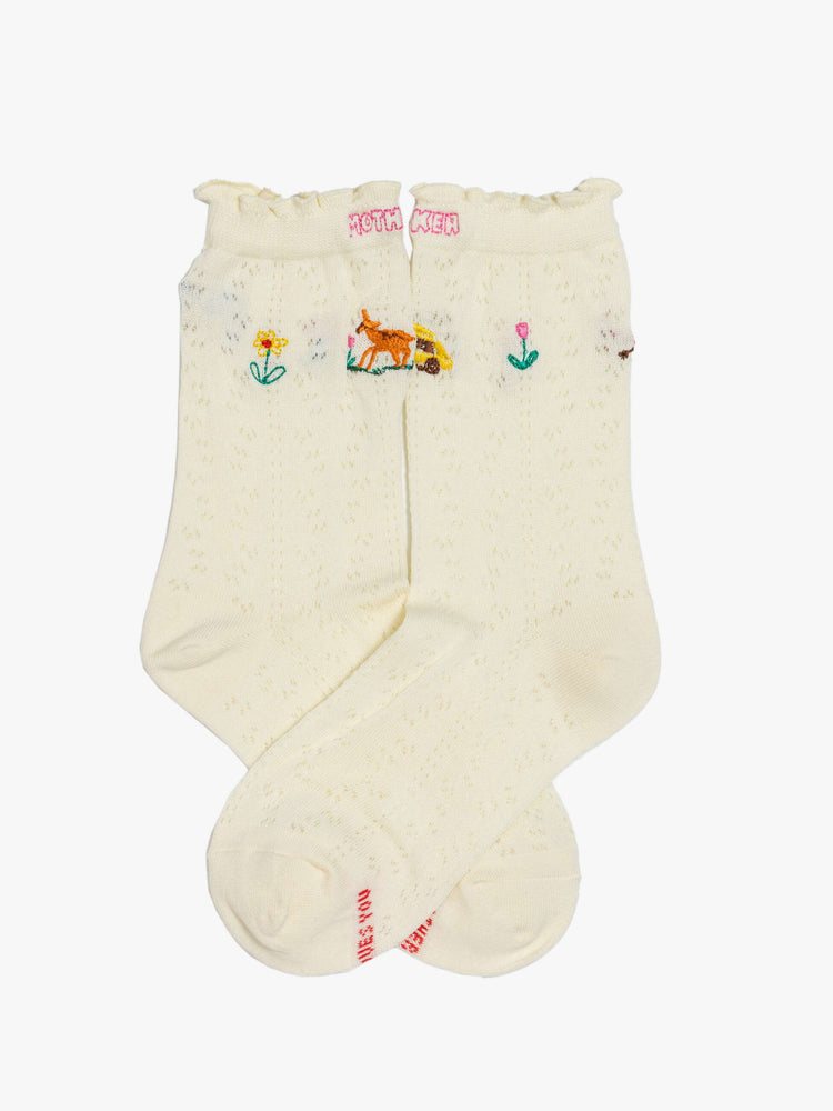 Flat view of white tube socks with a message from MOTHER with colorful embroidery throughout.