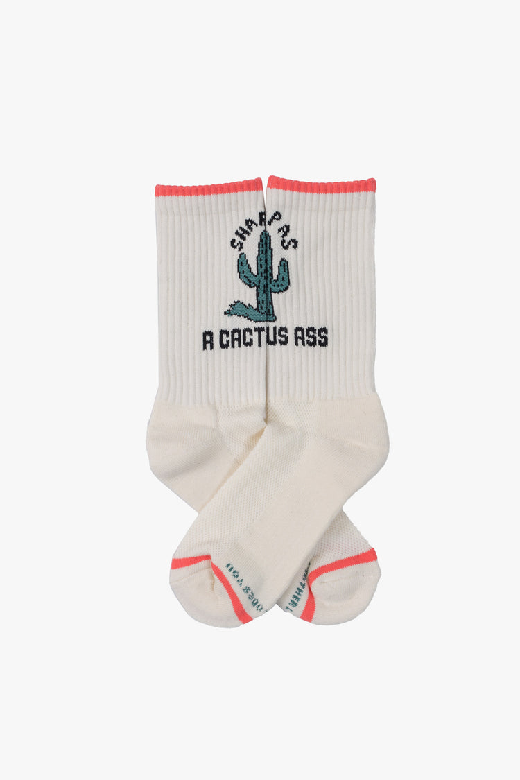 Flat view classic tube socks in white with black lettering, peach trim and a green cactus graphic on the front.