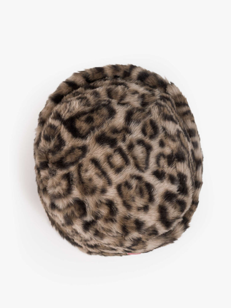 Flat of a hat with a wide folded brim and a decorative gold-toned pin with a pink heart.
