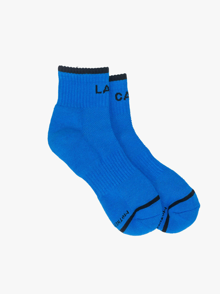 Flat side ankle-length tube socks in blue with black text and details.