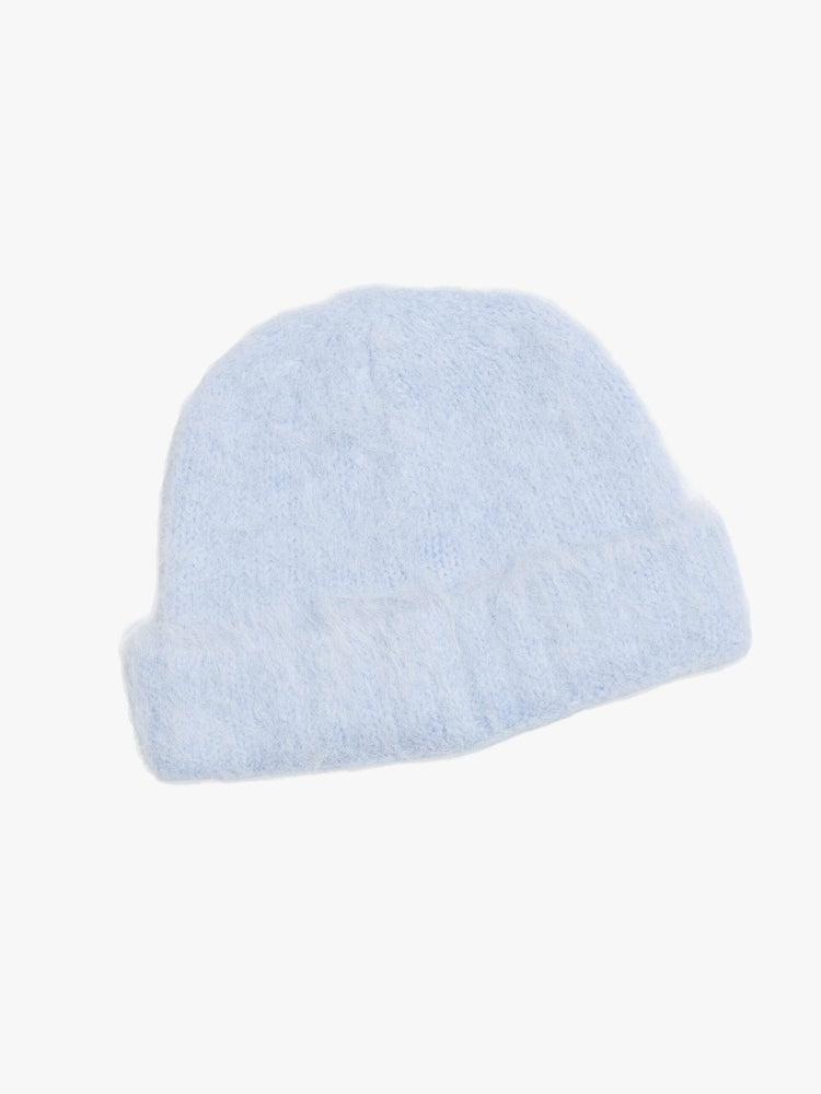 Flat back view of a blue with an M patch on the front ribbed beanie with a folded hem and cozy fit.