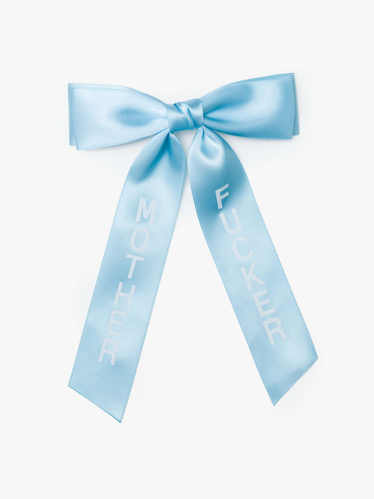Light blue satin-feel hair bow that looks sweet but says otherwise—with MOTHER on one tail and FUCKER on the other.