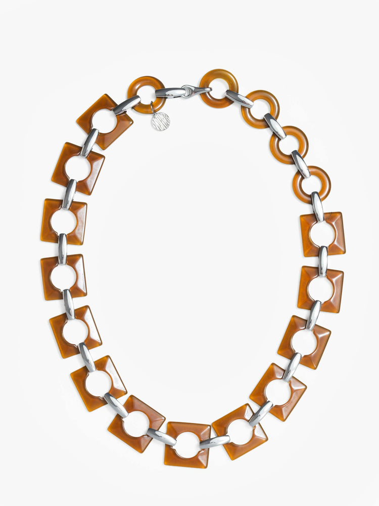 Flat chunky belt featuring brown square and circular resin pieces connected by metal links.