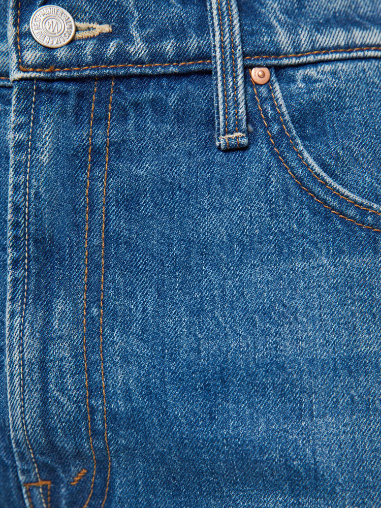 Swatch view of a woman in a medium blue wide-leg jeans are designed to sit lower on the hips with a zip fly and a clean ankle-length inseam. 