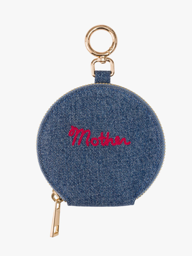 Front flat view of a Stash wallet designed in classic blue denim with MOTHER embroidered across the front in red, a zip closure and a 1-inch key ring.