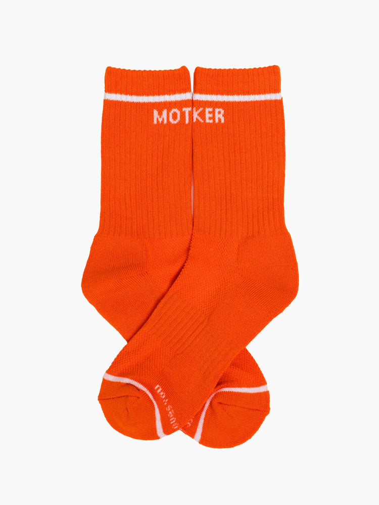 Flat view of a vintage-inspired tube socks in bright orange and bold lettering in white.