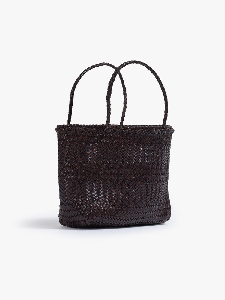 Side view of a dark brown woven tote bag.