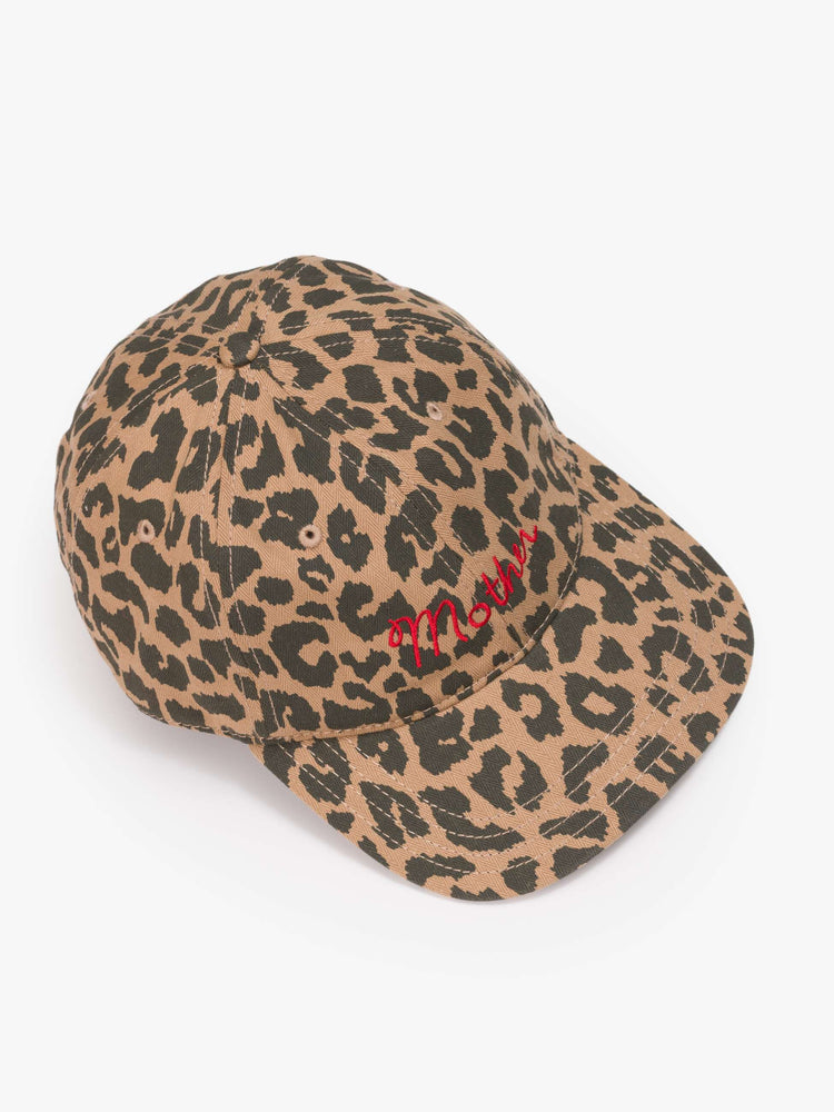Top view of a woman in a dad hat designed in leopard print with MOTHER's name embroidered in red cursive on the front.