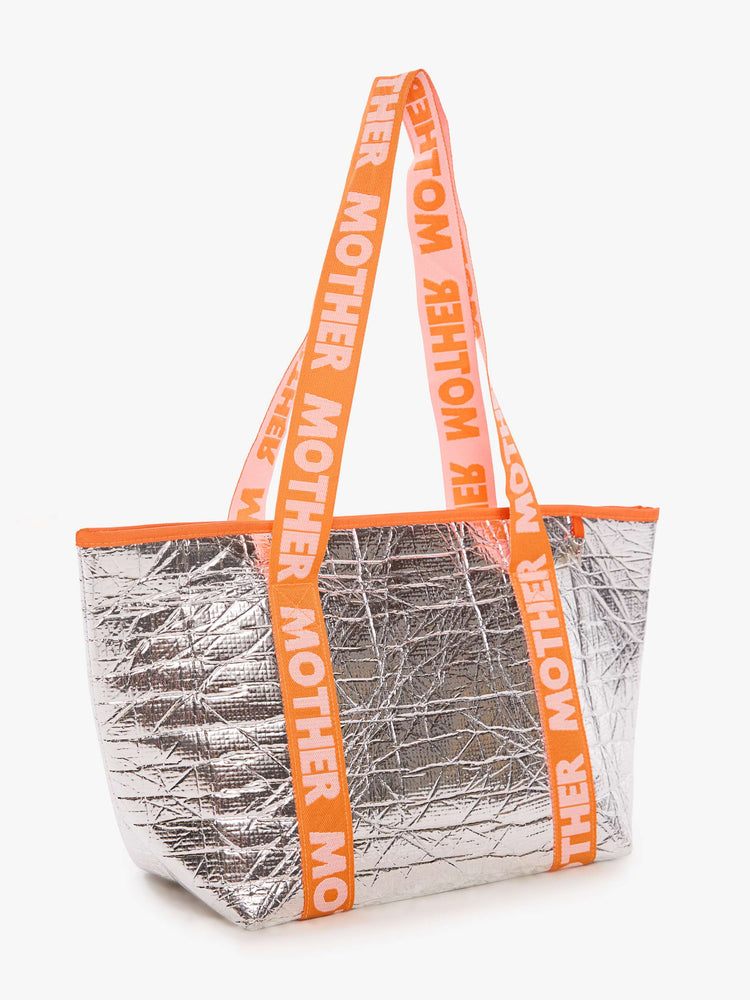 Flat metallic silver with a branded orange-and-baby-pink strap and decorative heart charm, and measures 11-inches wide and 10-inches tall with a 5 1/2-inch gusset.