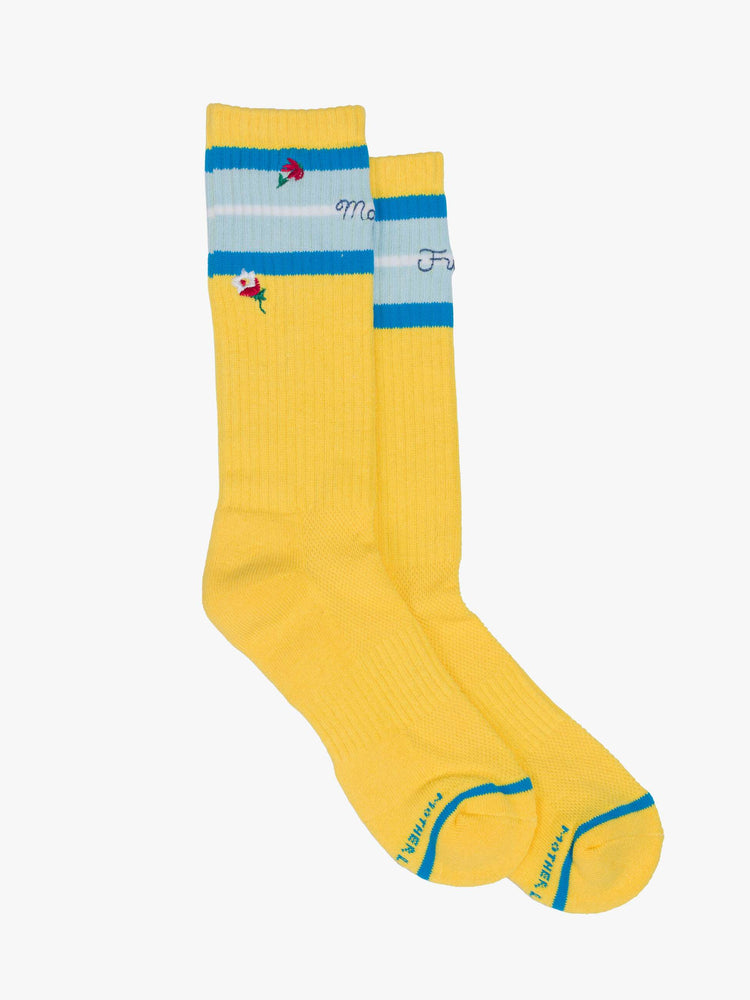 Flats view of extra-tall tube socks with an explicit message from MOTHER. Shown here in yellow with blue stripes and text across the top