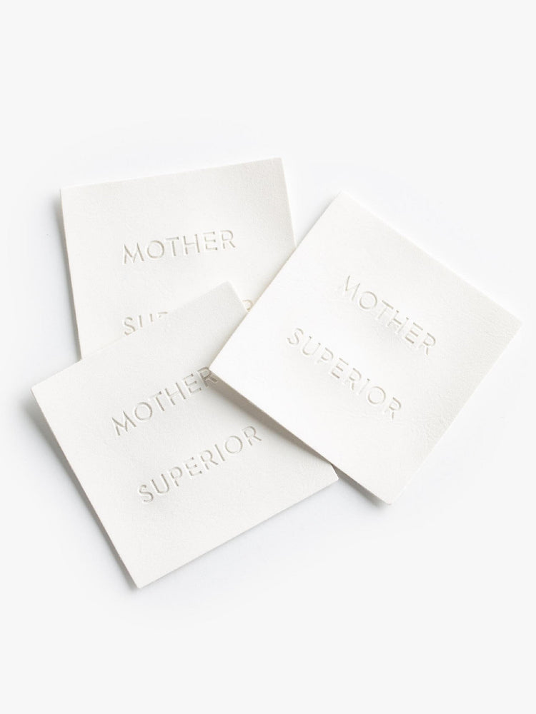 Image of White "MOTHER SUPERIOR" label.