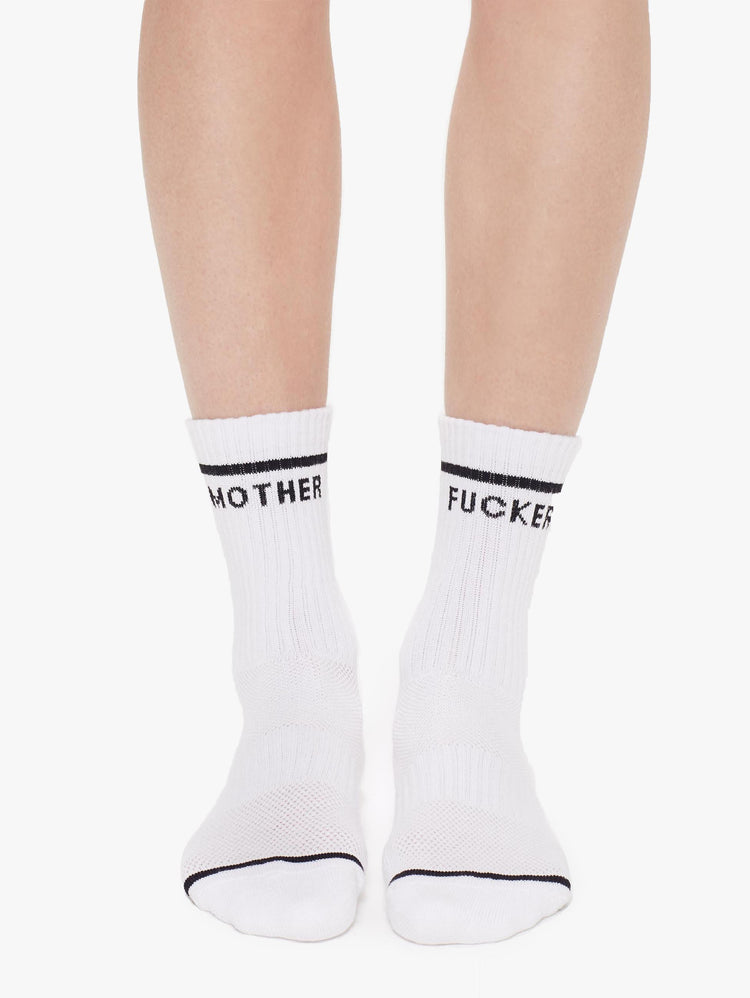 Front view of a womens pair of white socks with the words "MOTHER" and "FUCKER".