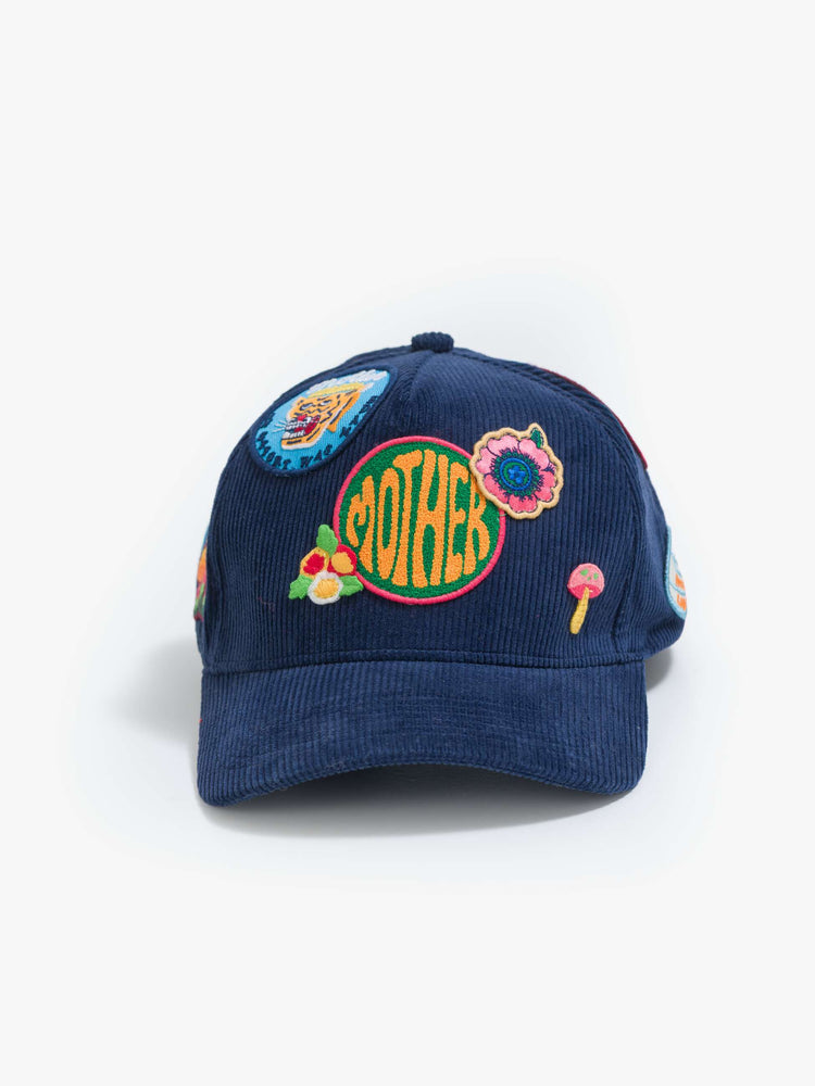 Flat view of in a navy corduroy hat with MOTHER's name on the front and colorful patches throughout.