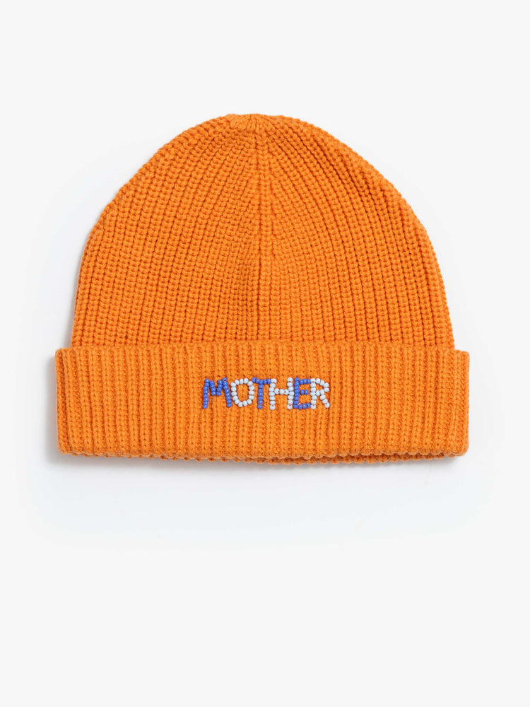 Flat view of a woman in an orange with light blue and white beads ribbed beanie with a folded hem.