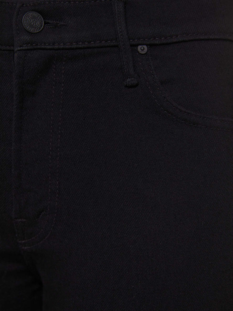 Swatch view of a woman in a black high-rise straight leg jean with a 30-inch inseam and a clean hem.