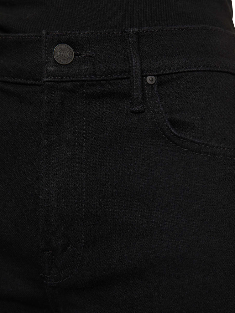 Swatch view of a woman in a black high-rise straight leg jean with a 30-inch inseam and a clean hem.