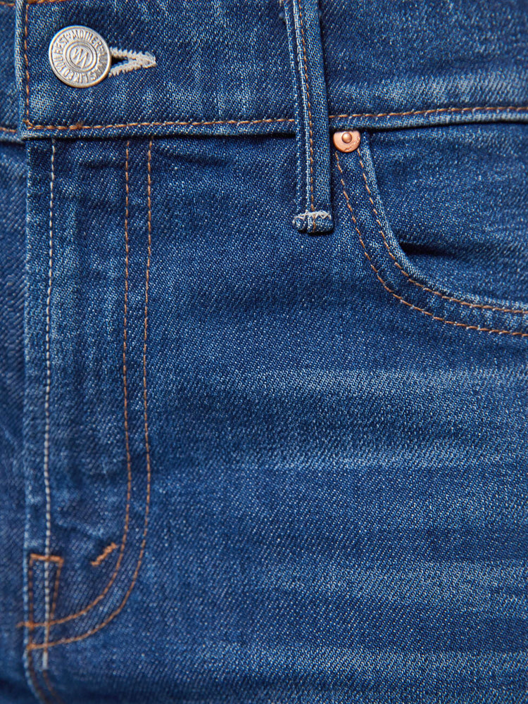 Swatch view of a petite woman in a high-rise straight leg jean with a zip fly, 29-inch inseam and a clean hem.