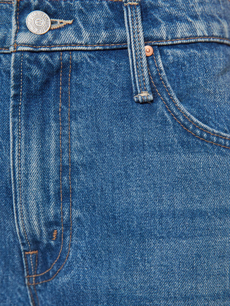Swatch view of a woman in jeans designed to sit on the hips with a slouchy fit, a loose straight leg, button fly and a 26.25-inch inseam with a clean hem.