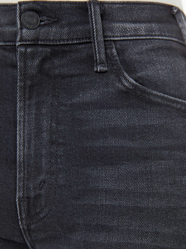 Swatch view of a petite woman in a black wash  wide leg jeans with a high rise, 30-inch inseam and a clean hem. 