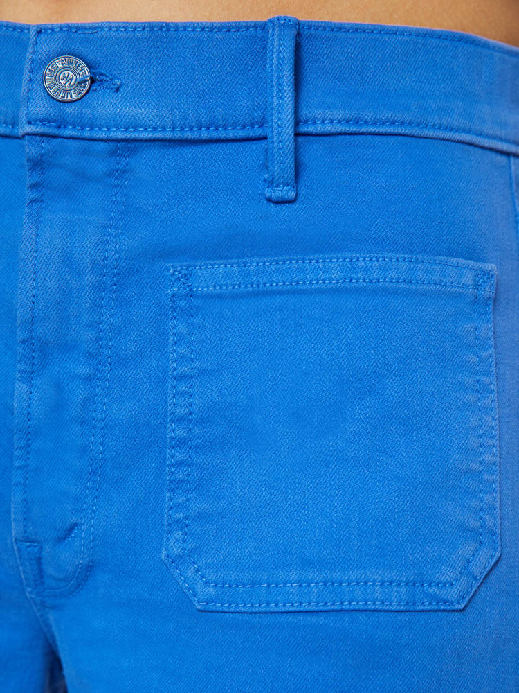Swatch view of a woman in a bright sea blue wide leg pants with a high rise, patch pockets and a clean hem.
