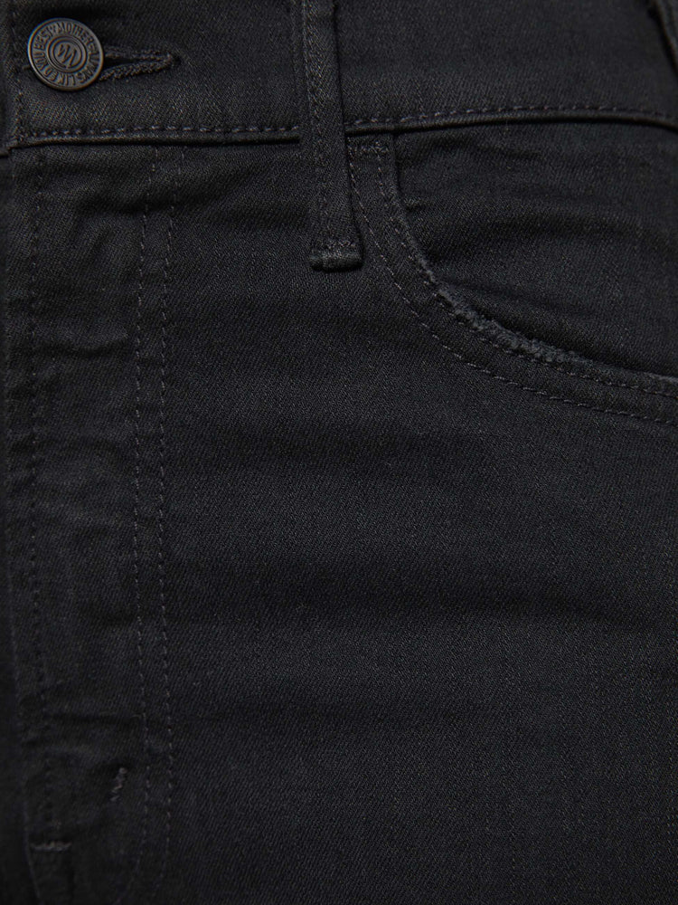 Swatch view of a woman black denim high-rise flare has an ankle-length inseam and a frayed hem.