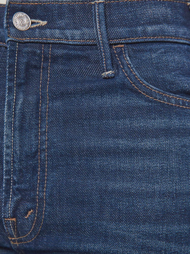 Swatch view of a petite woman in a dark blue wide leg jeans with a high rise, zip fly and a long 30-inch inseam with an extra-wide cuffed hem.