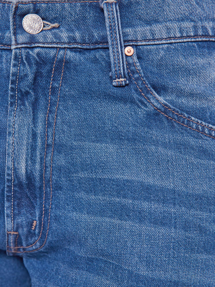 Swatch  view of a woman in Jeans designed to sit lower on the hips with a 28-inch inseam, zip fly, clean hem and slightly tapered leg. 