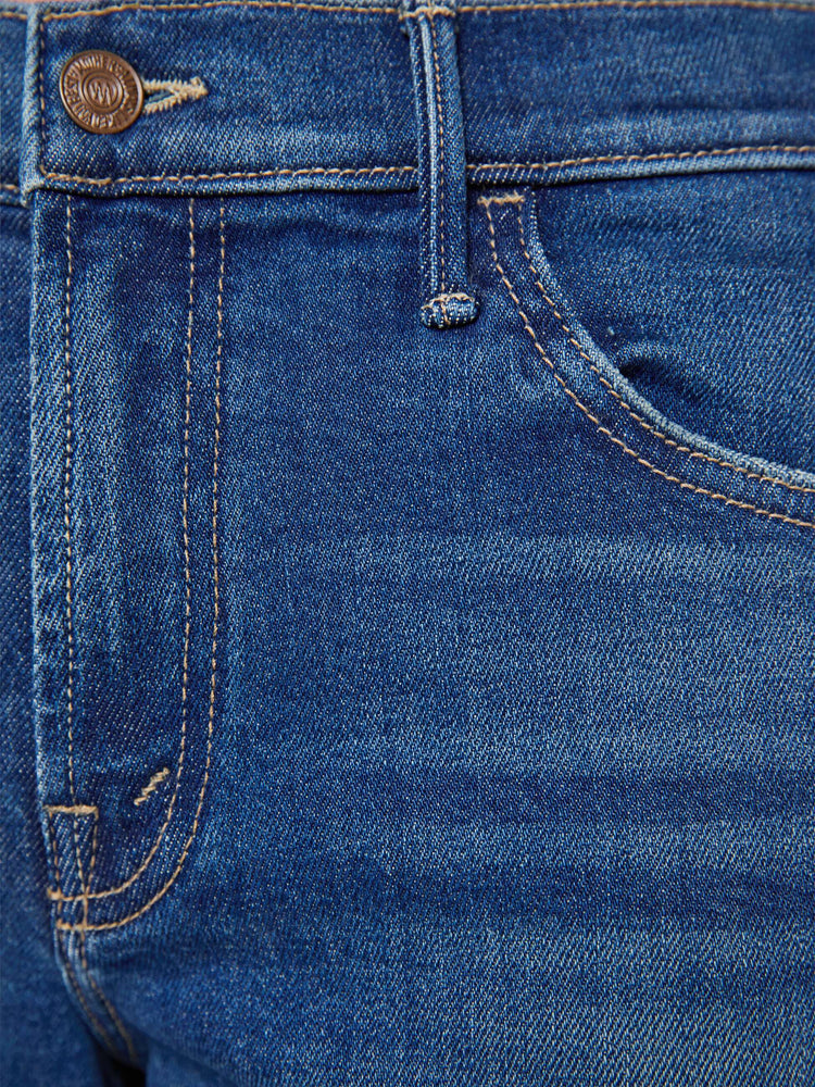 Swatch view of a petite woman in a med blue wide leg jeans with a high rise, zip fly, double-stitched side seam, 29-inch inseam and a clean hem.