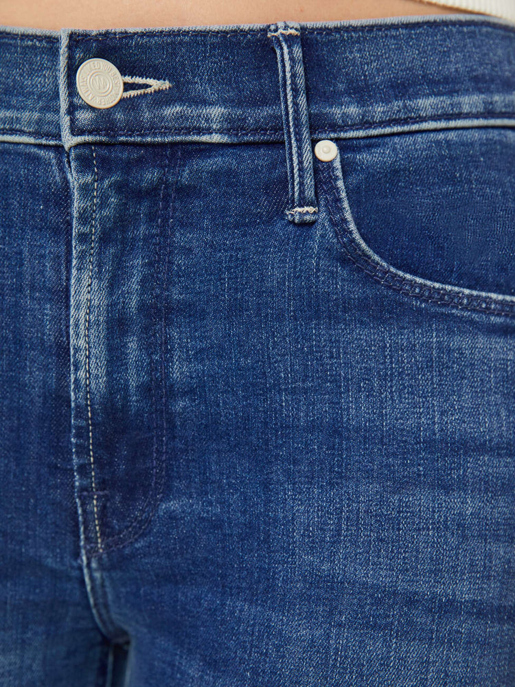 Swatch view of a petite woman mid-rise straight leg jean its at the ankle with a clean hem in a mid blue wash.