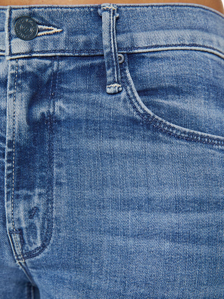 Close up detail view of a medium blue wash jean.
