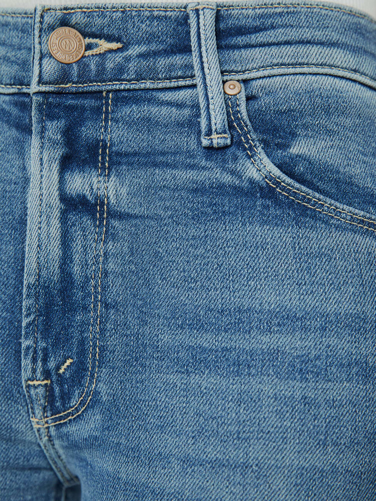 Close up view of a medium blue wash jean.