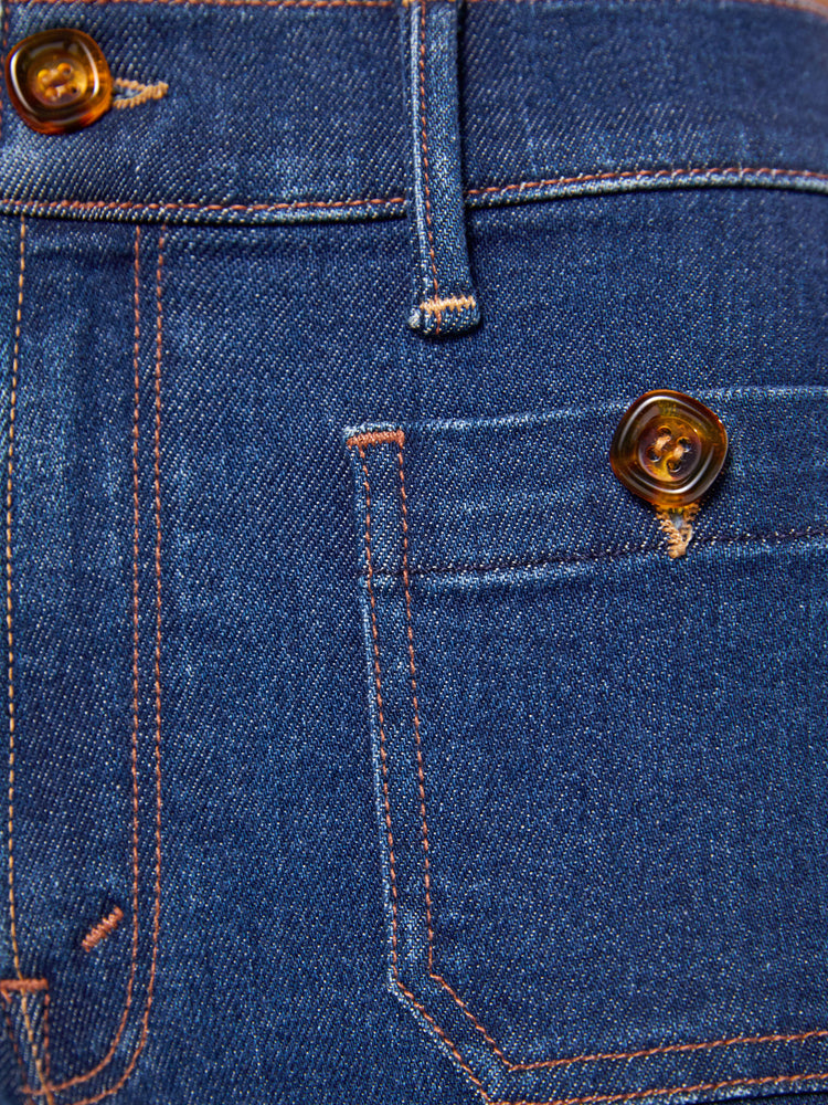 Close up swatch of dark blue denim jeans.