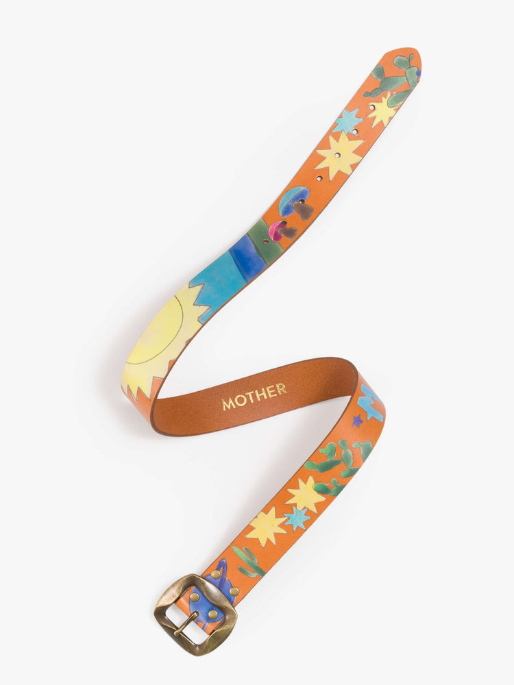 Flat view of a  belt made from 100% leather in tan with hand-painted stars, mushrooms and rainbow stripes, and an oversized brass buckle.
