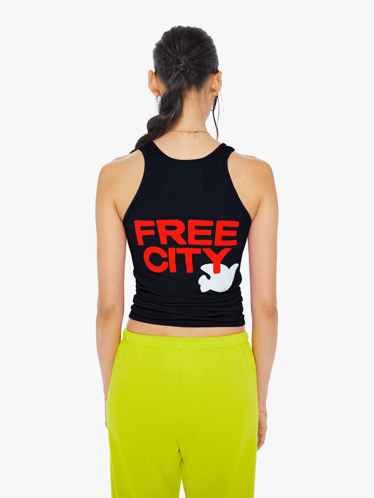 Back view of a womens dark navy ribbed tank featuring a large back graphic reading "FREE CITY".