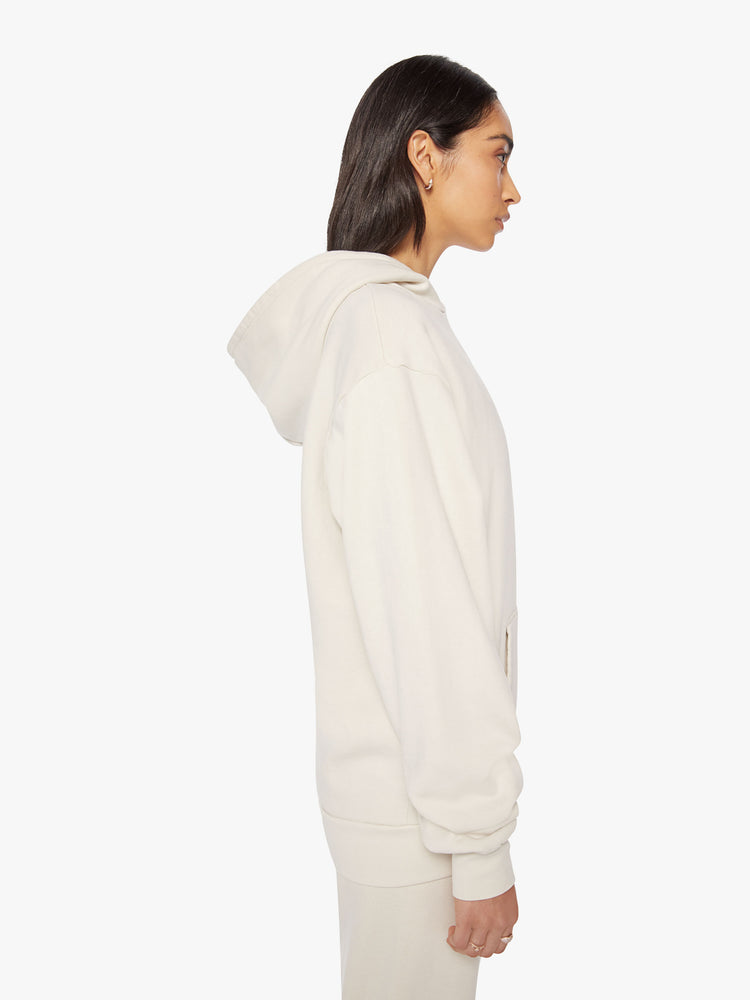 Side profile view of a Womens white hoodie pullover with a front kangaroo pocket.