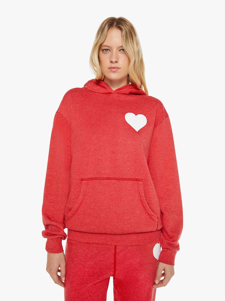 Front view of a woman in red sweatshirt has a front patch pocket and a loose, comfortable fit.