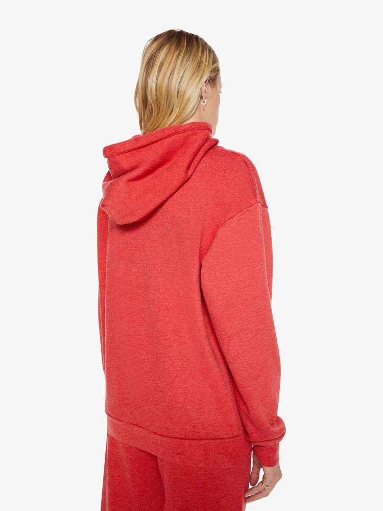 Back view of a woman in red sweatshirt has a front patch pocket and a loose, comfortable fit.