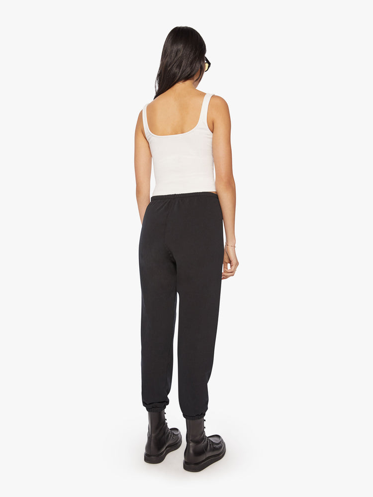 Full body back view of a Womens black sweatpant