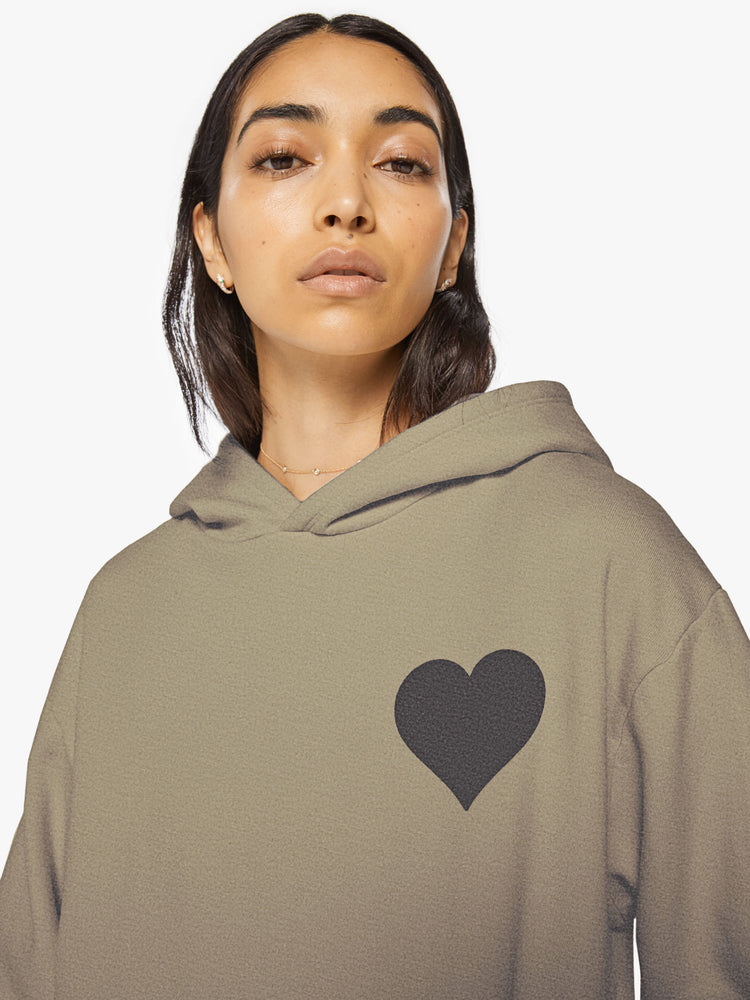 Close up view of a woman army green sweatshirt has a front patch pocket and a loose, comfortable fit.