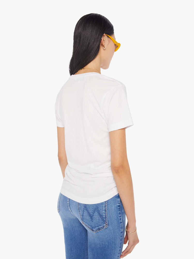 Back view of a women's white t-shirt with red "Fake" graphic