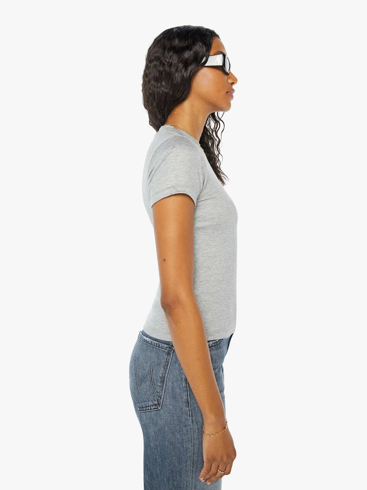Side view of a womens heather grey crew neck fitted tee.