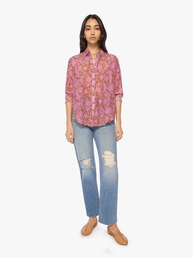Full body view of a woman floral button-down.