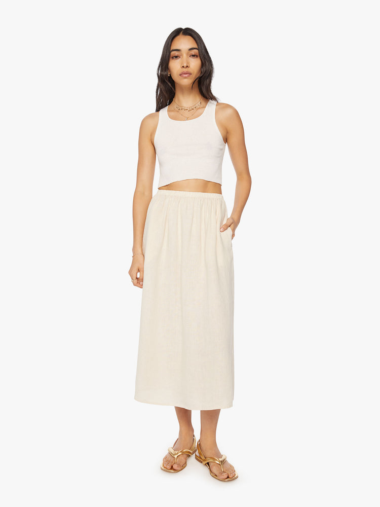 Front view of a woman maxi skirt features a high rise, elastic waistband, and a loose, flowy fit.