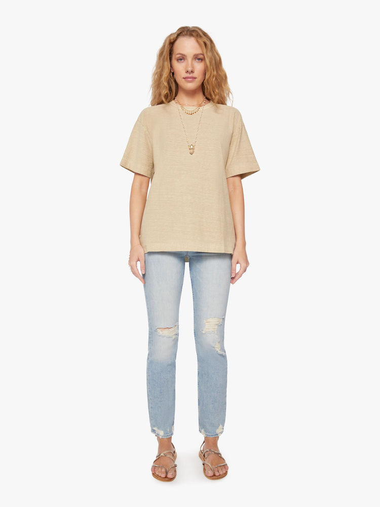 Full body view of a woman in a Model Crop T features drop shoulders, a boxy fit and a slightly cropped hem in a soft khaki hue.