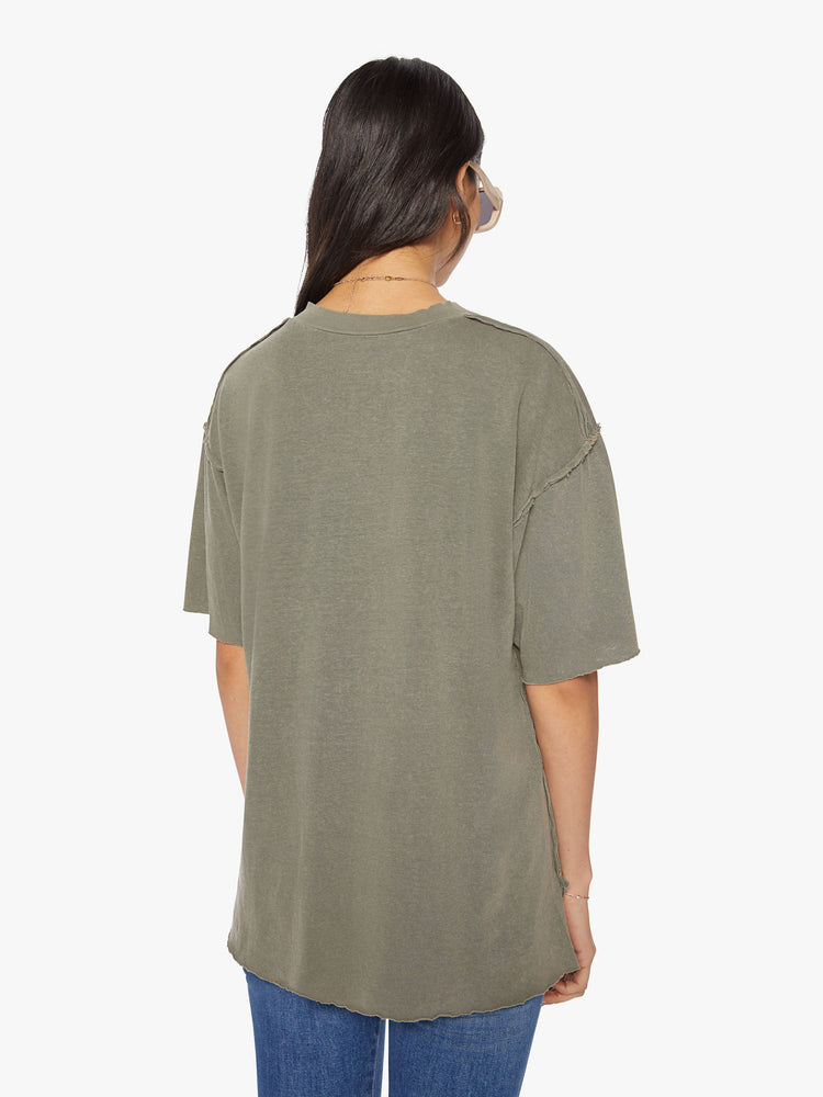Back  view of a woman in a cropped crewneck tee with drop shoulders, a boxy fit in a sage green hue.