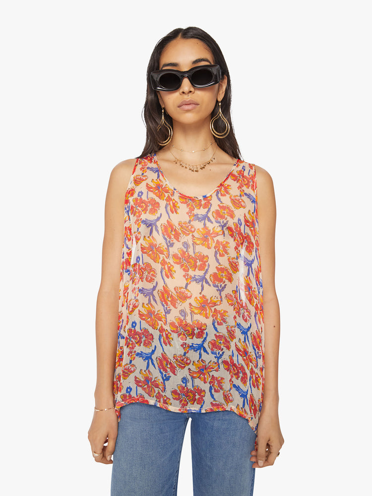 Front view of a woman tank in off-white chiffon with a watercolor floral print in orange and navy with a hip-grazing hem.